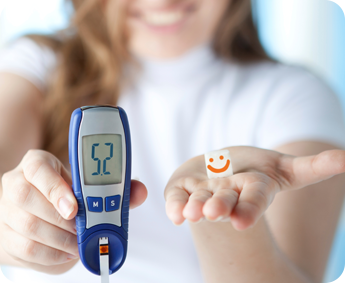 Woman Doing a Blood Test with Glucometer